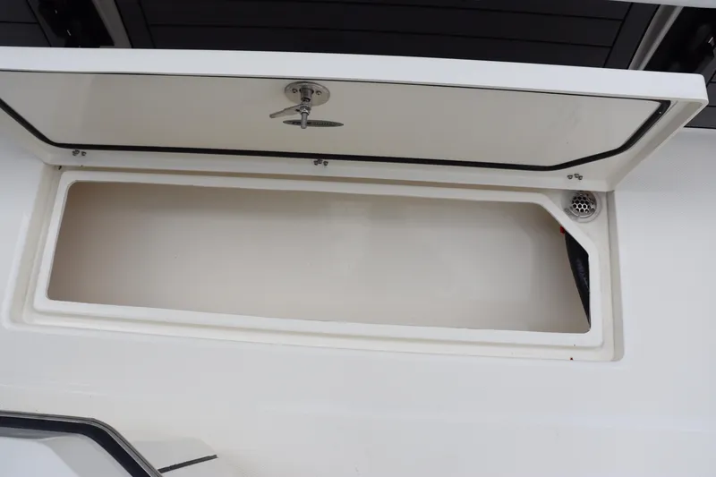 Slide: The Image of Open storage compartment on a 2024 Pathfinder 2400 Open boat. - 35