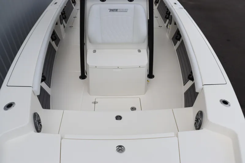 Slide: The Image of 2024 Pathfinder 2400 Open boat interior with white seating and storage compartments. - 8