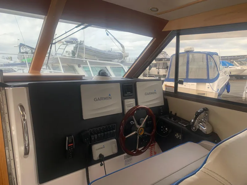 Slide: The Image of 2018 Cutwater C 302 Coupe helm with Garmin navigation system. - 6