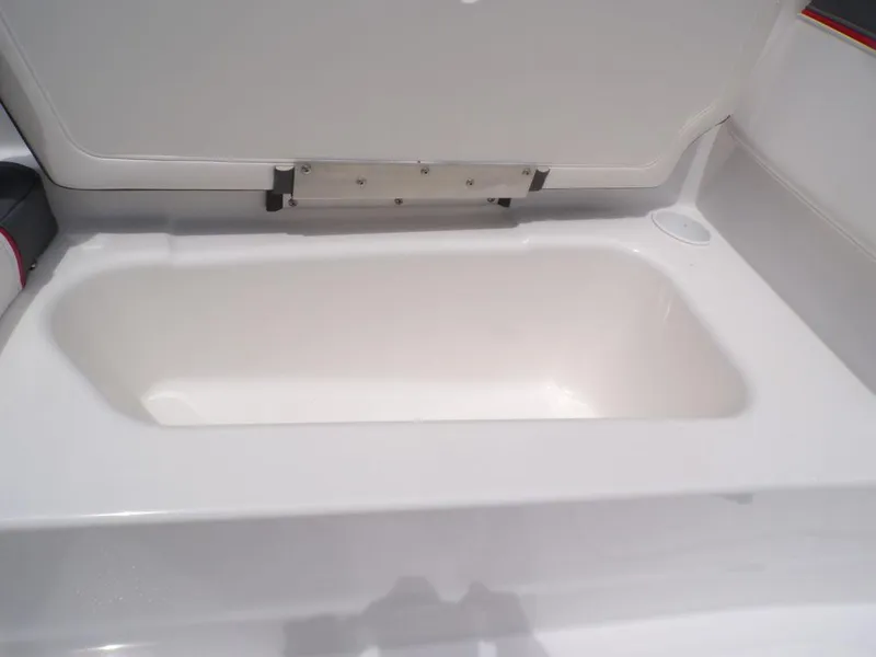 Slide: The Image of 2024 Tahoe T16 storage compartment with open lid, showcasing spacious interior. - 12