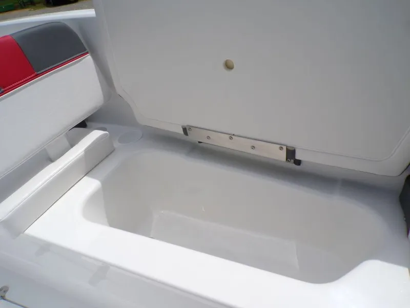 Slide: The Image of 2024 Tahoe T16 boat storage compartment with open lid, showcasing spacious interior. - 14