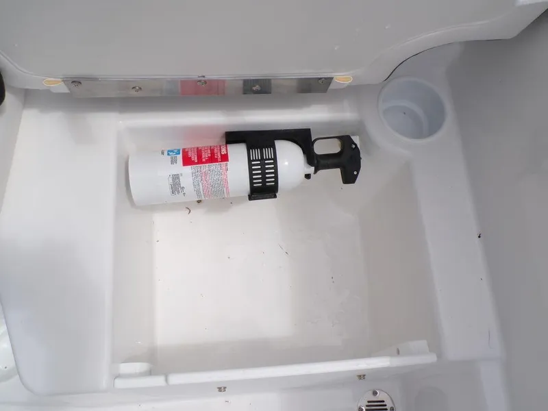 Slide: The Image of 2024 Tahoe T16 storage compartment with fire extinguisher. - 19