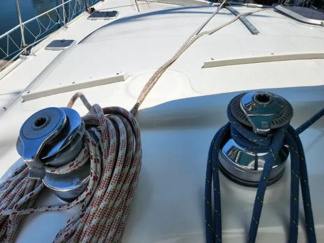 Slide: The Image of Winches and ropes on the deck of a 2000 Ocean Cat 49 sailboat. - 14