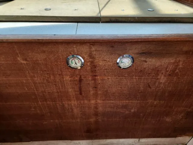 Slide: The Image of Wooden dashboard of Ocean Cat 49 boat with two gauges, model year 2000. - 39