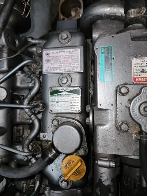 Slide: The Image of Close-up of Ocean Cat 49 engine, 2000 model, showing detailed components and labels. - 49