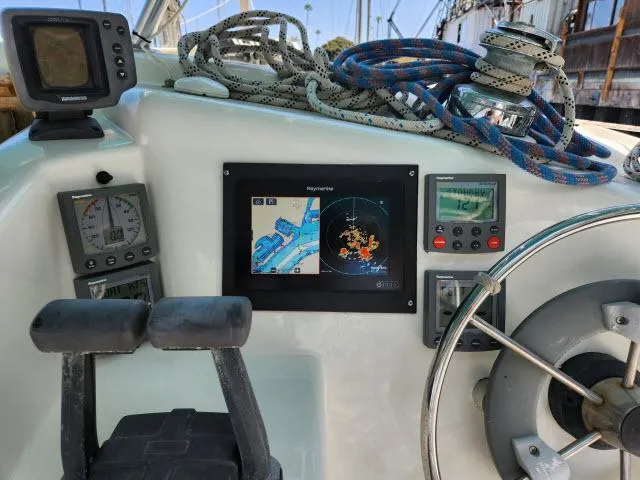 Slide: The Image of Control panel of a 2000 Ocean Cat 49 sailboat with navigation equipment. - 9