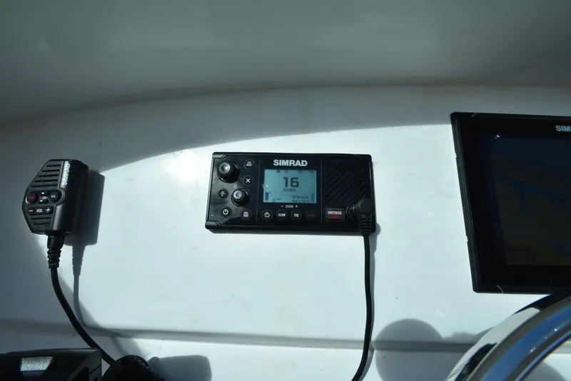 Slide: The Image of Simrad marine radio and navigation system on 2023 Custom Aljerewy Wave Master boat. - 11