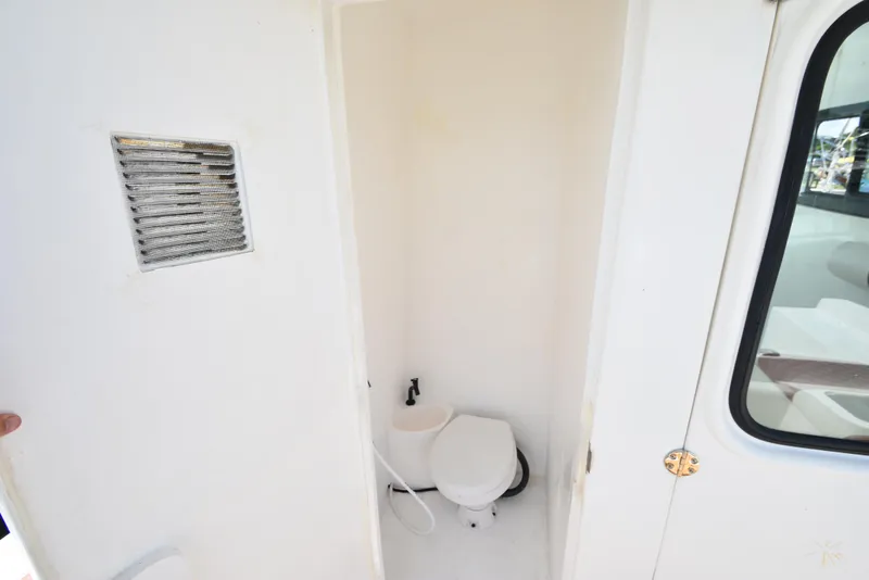 Slide: The Image of 2023 Custom Aljerewy Wave Master boat bathroom with toilet and ventilation. - 16