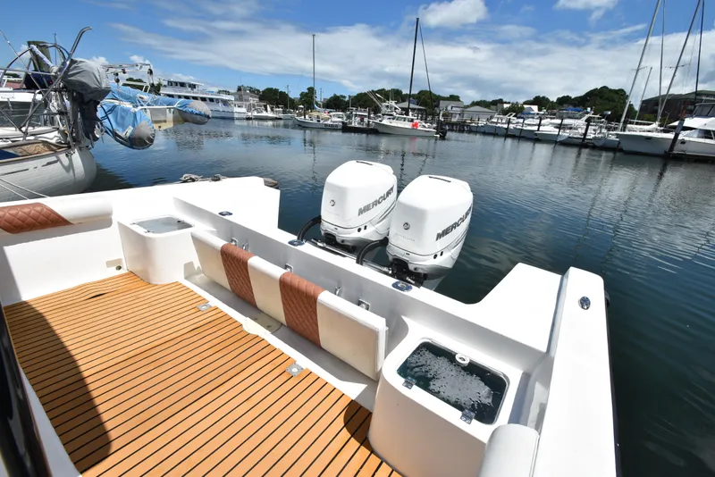 Slide: The Image of Custom Aljerewy Wave Master 2023 boat with twin Mercury engines docked at marina. - 17