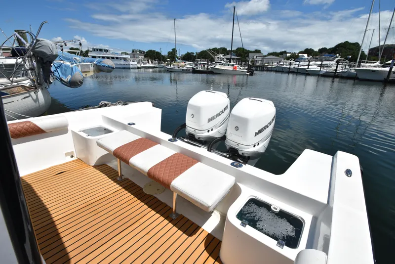 Slide: The Image of Custom Aljerewy Wave Master 2023 boat with twin Mercury engines docked at marina. - 18