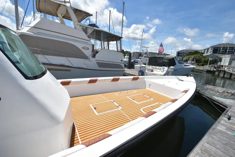 Slide: The Image of Custom Aljerewy Wave Master 2023 boat docked at marina with other yachts. - 21