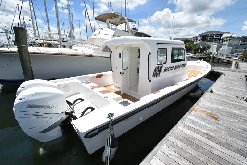 Slide: The Image of Custom 2023 Aljerewy Wave Master 40F boat docked with twin Mercury outboard engines. - 28