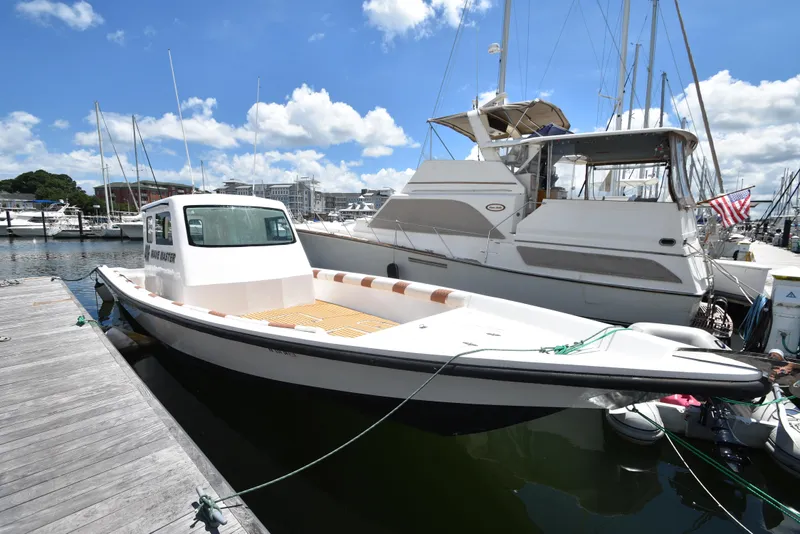 Slide: The Image of Custom 2023 Aljerewy Wave Master boat docked at marina on a sunny day. - 3