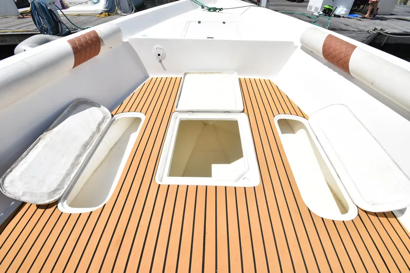Slide: The Image of Deck of 2023 Custom Aljerewy Wave Master boat with open storage compartments. - 6