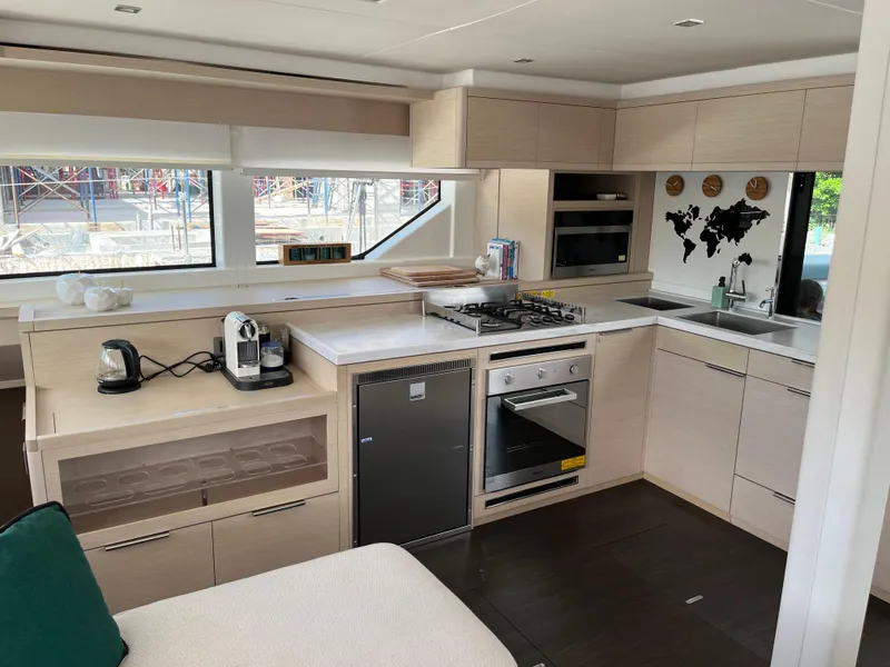 Slide: The Image of Modern kitchen interior of 2021 Lagoon 55 yacht with appliances and sleek cabinetry. - 17