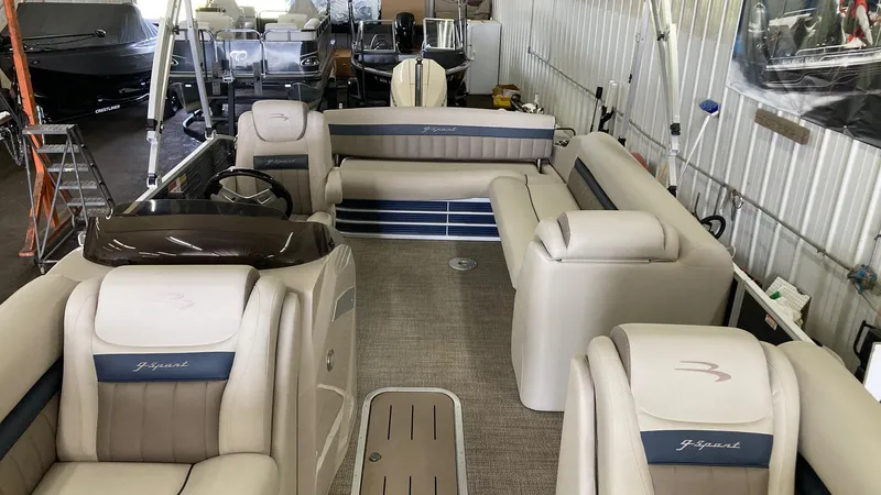 Slide: The Image of 2019 Bennington 23 GSB pontoon boat interior with luxurious seating and helm station. - 14