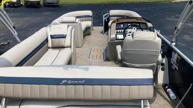 Slide: The Image of 2019 Bennington 23 GSB pontoon boat interior with beige and blue seating. - 4