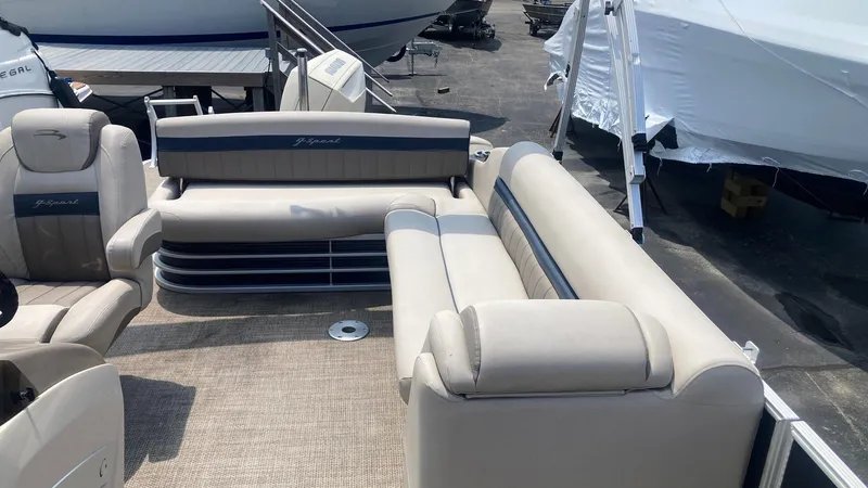 Slide: The Image of 2019 Bennington 23 GSB pontoon boat interior with beige seating. - 5
