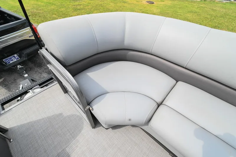 Slide: The Image of 2022 Manitou 25 Oasis VP boat with gray cushioned seating. - 35