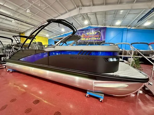 Slide: The Image of 2025 Bennington 24 LXSBA pontoon boat in showroom. - 1