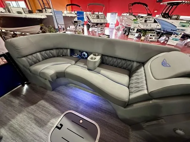 Slide: The Image of 2025 Bennington 24 LXSBA pontoon boat interior with modern dashboard and seating. - 11
