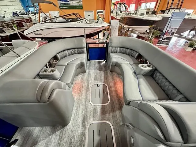 Slide: The Image of 2025 Bennington 24 LXSBA boat interior with modern dashboard and steering wheel. - 14
