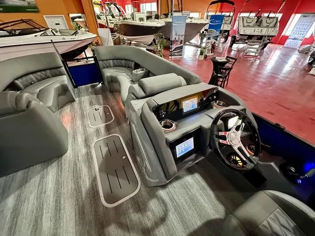 Slide: The Image of 2025 Bennington 24 LXSBA pontoon boat interior with luxurious seating and modern design. - 16