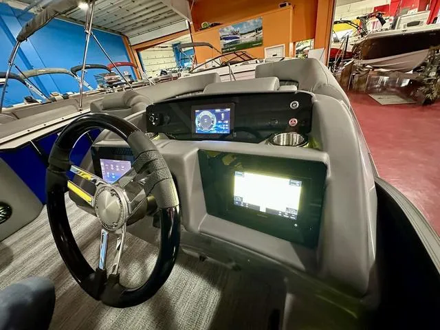 Slide: The Image of 2025 Bennington 24 LXSBA boat with motor and boarding ladder. - 17