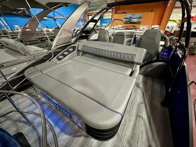 Slide: The Image of 2025 Bennington 24 LXSBA pontoon boat in showroom. - 22