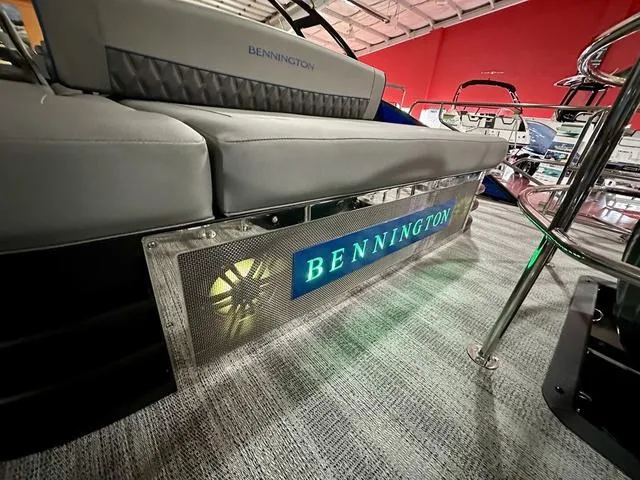Slide: The Image of 2025 Bennington 24 LXSBA pontoon boat in showroom. - 26