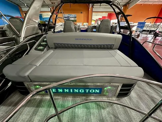 Slide: The Image of 2025 Bennington 24 LXSBA pontoon boat in showroom. - 27