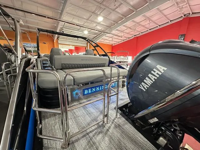 Slide: The Image of 2025 Bennington 24 LXSBA pontoon boat with Yamaha engine in showroom. - 28