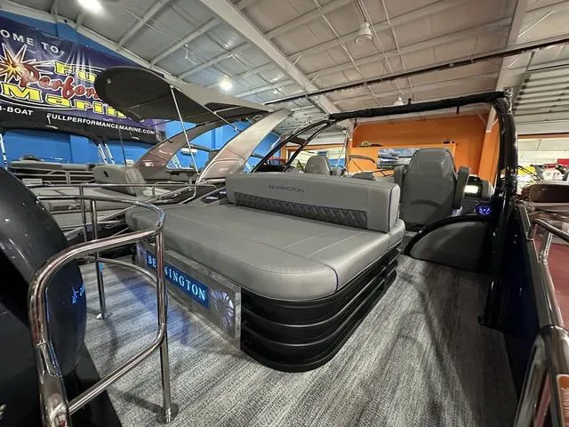 Slide: The Image of 2025 Bennington 24 LXSBA pontoon boat interior at showroom display. - 31