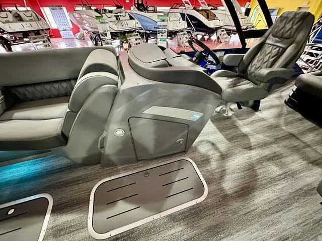 Slide: The Image of 2025 Bennington 24 LXSBA pontoon boat in showroom with Yamaha 350 V6 engine. - 6