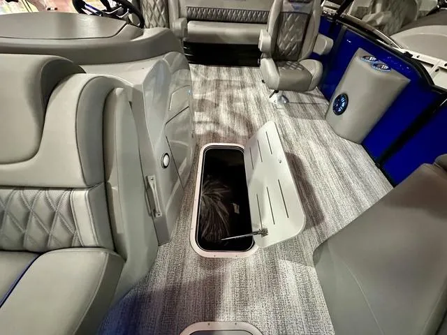 Slide: The Image of 2025 Bennington 24 LXSBA pontoon boat interior with luxurious seating and modern design. - 7