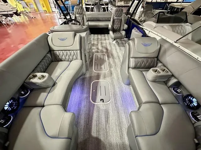 Slide: The Image of 2025 Bennington 24 LXSBA pontoon boat on display at Performance Marine showroom. - 9