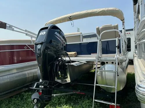 Slide: The Image of 2025 Sun Tracker Bass Buggy 16 XL Select pontoon boat with Mercury 50 HP outboard motor. - 4