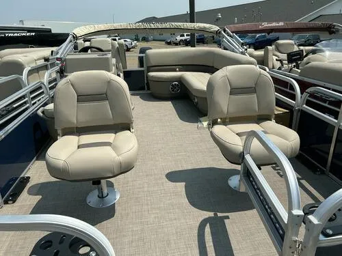 Slide: The Image of 2025 Sun Tracker Bass Buggy 16 XL Select pontoon boat with beige seating and spacious deck. - 6