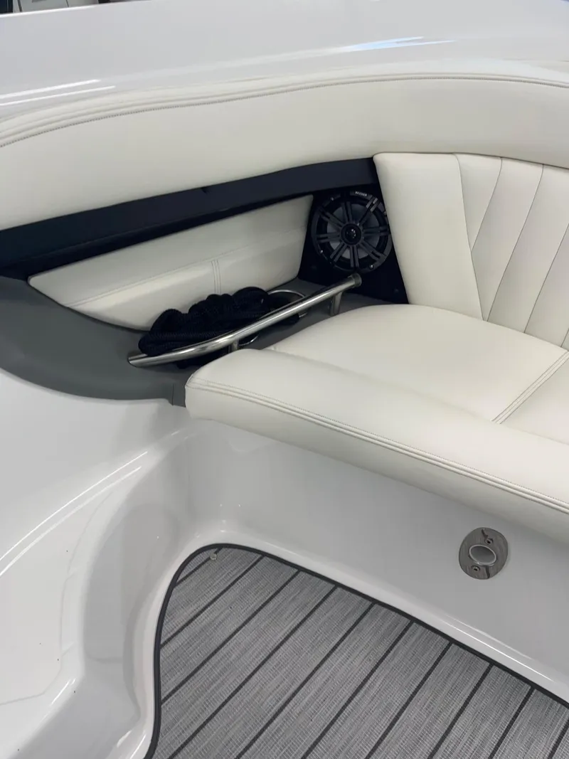 Slide: The Image of Luxury seating in a 2005 Cobalt 343 boat with white upholstery and speaker. - 10