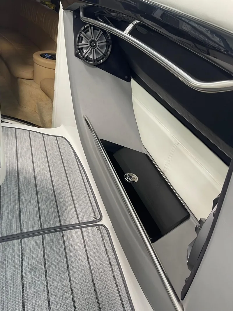 Slide: The Image of Interior view of a 2005 Cobalt 343 boat, featuring sleek design and speaker system. - 11