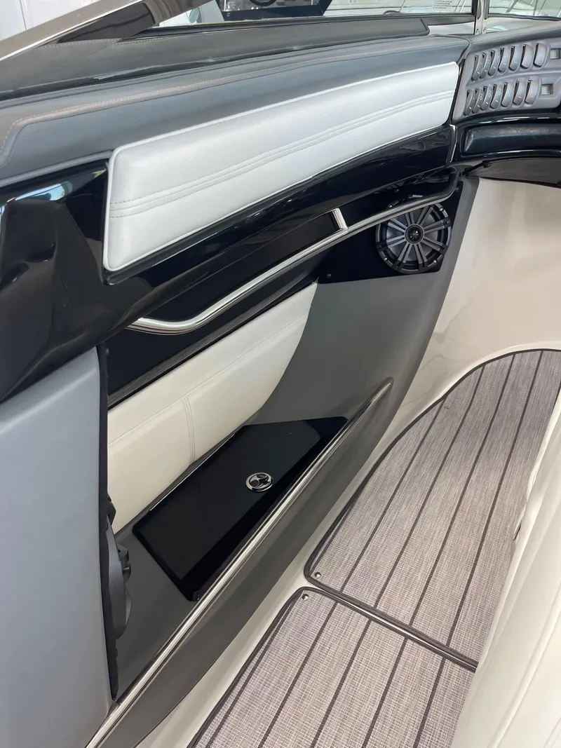 Slide: The Image of 2005 Cobalt 343 boat interior with sleek design and modern audio system. - 12