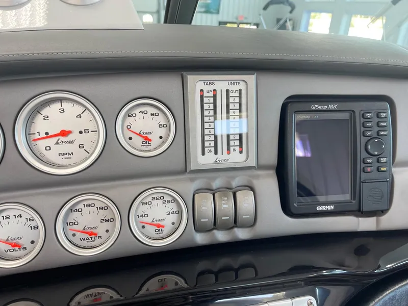 Slide: The Image of Dashboard of a 2005 Cobalt 343 boat with gauges and Garmin GPS. - 16