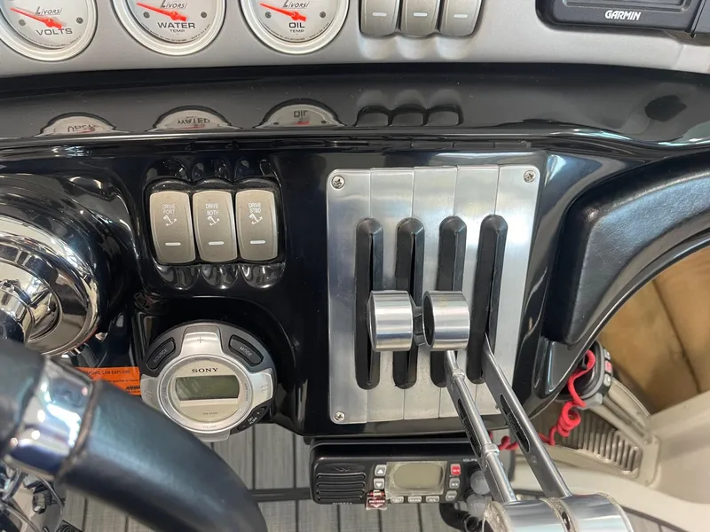 Slide: The Image of Control panel of a 2005 Cobalt 343 boat with gauges and switches. - 17