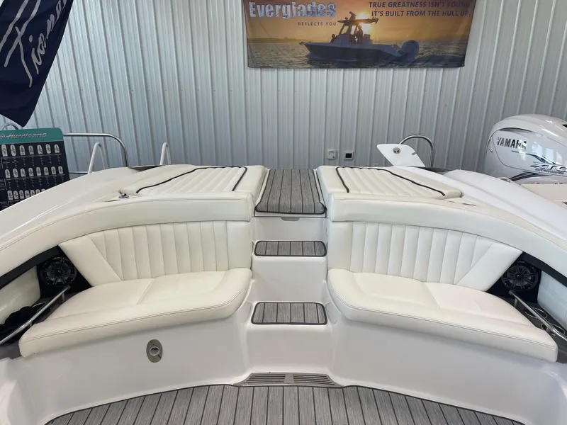 Slide: The Image of 2005 Cobalt 343 boat interior with white seating and wood accents. - 7