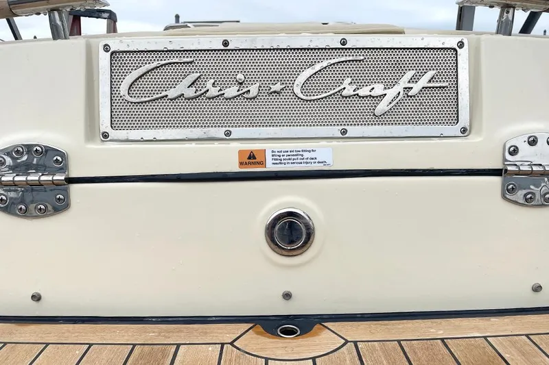 Slide: The Image of 2022 Chris-Craft Launch 27 boat stern with logo and warning label. - 4