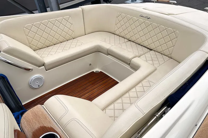 Slide: The Image of 2022 Chris-Craft Launch 27 boat with luxurious beige leather seating and wooden flooring. - 8