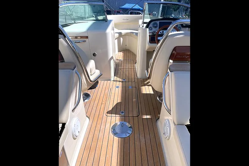 Slide: The Image of 2022 Chris-Craft Launch 27 interior with teak flooring and luxurious seating. - 9