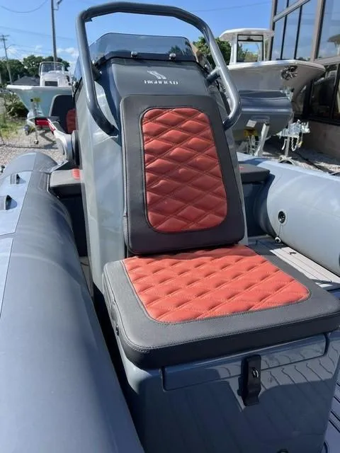 Slide: The Image of 2024 Highfield Sport 460 boat with red and gray seating. - 3