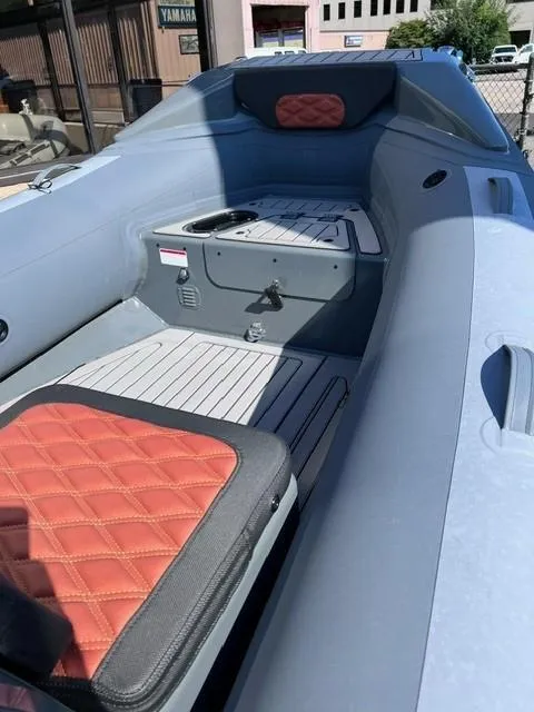 Slide: The Image of 2024 Highfield Sport 460 boat interior with red and black seating. - 4