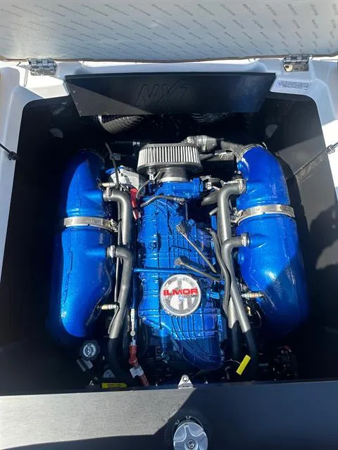 Slide: The Image of 2024 MasterCraft NXT23 boat engine compartment with Ilmor engine. - 22